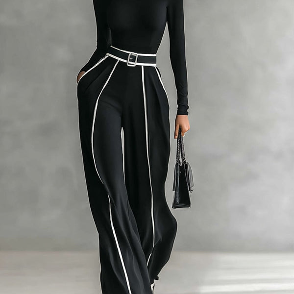 Completo due pezzi da donna con maglia a collo alto e pantaloni larghi con cintura